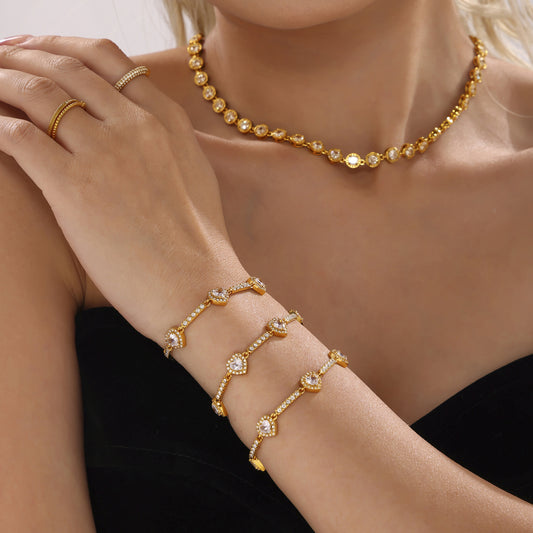 Gold and diamond heart-shaped lucky charm bracelet